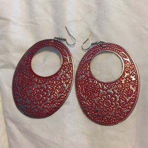 Red and silver earrings.